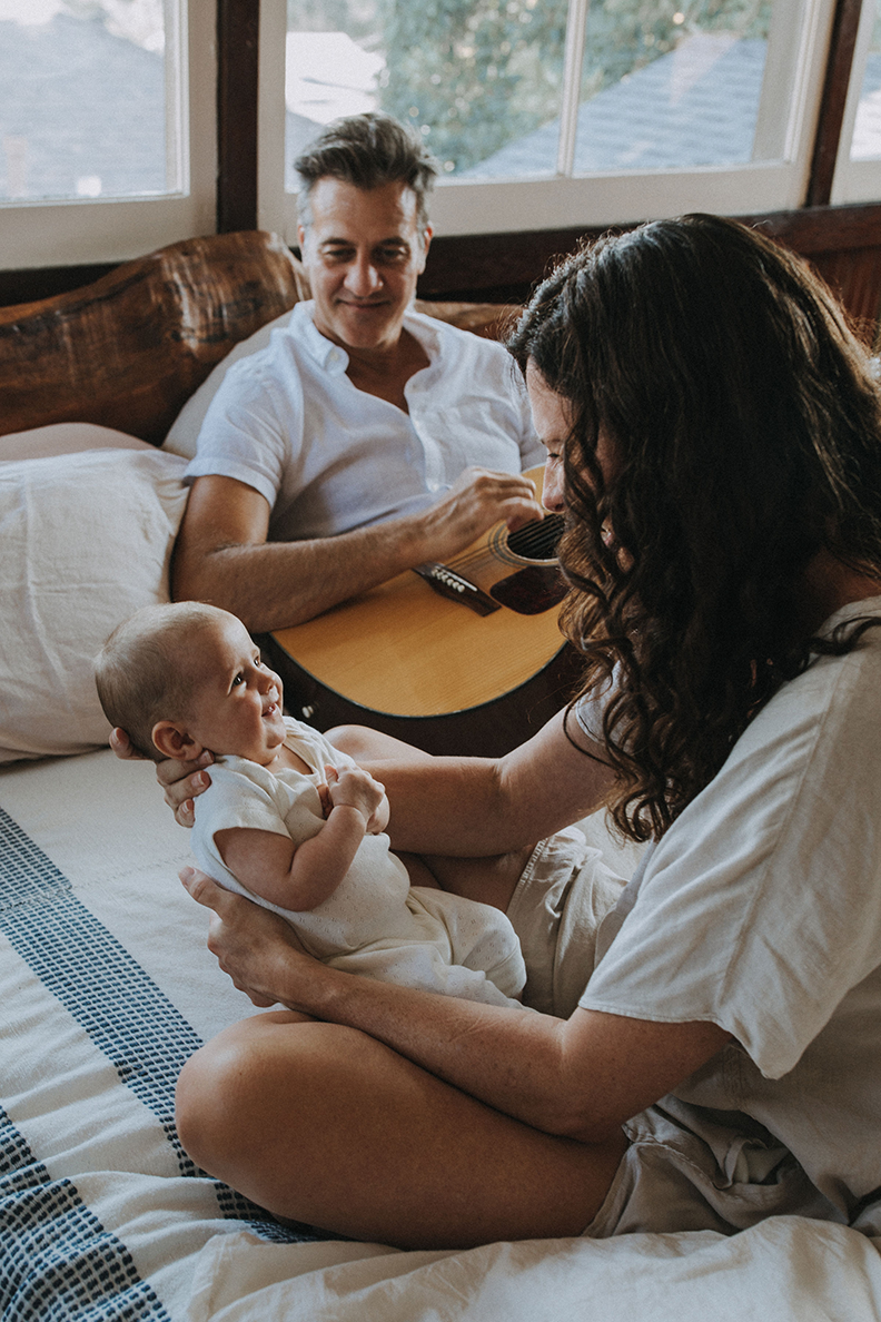 Family laughing together during a portrait session