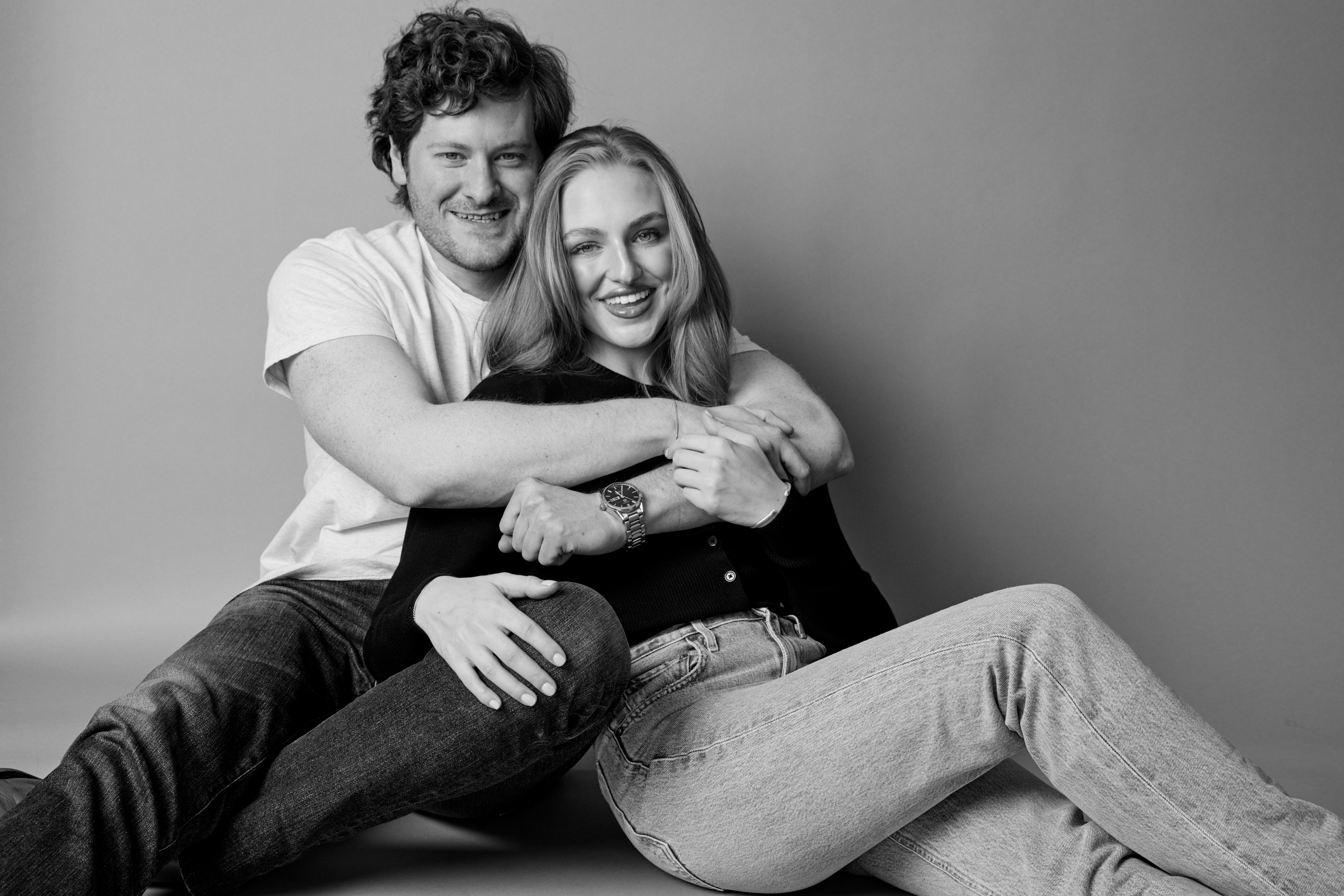 Wide environmental portrait of a couple
