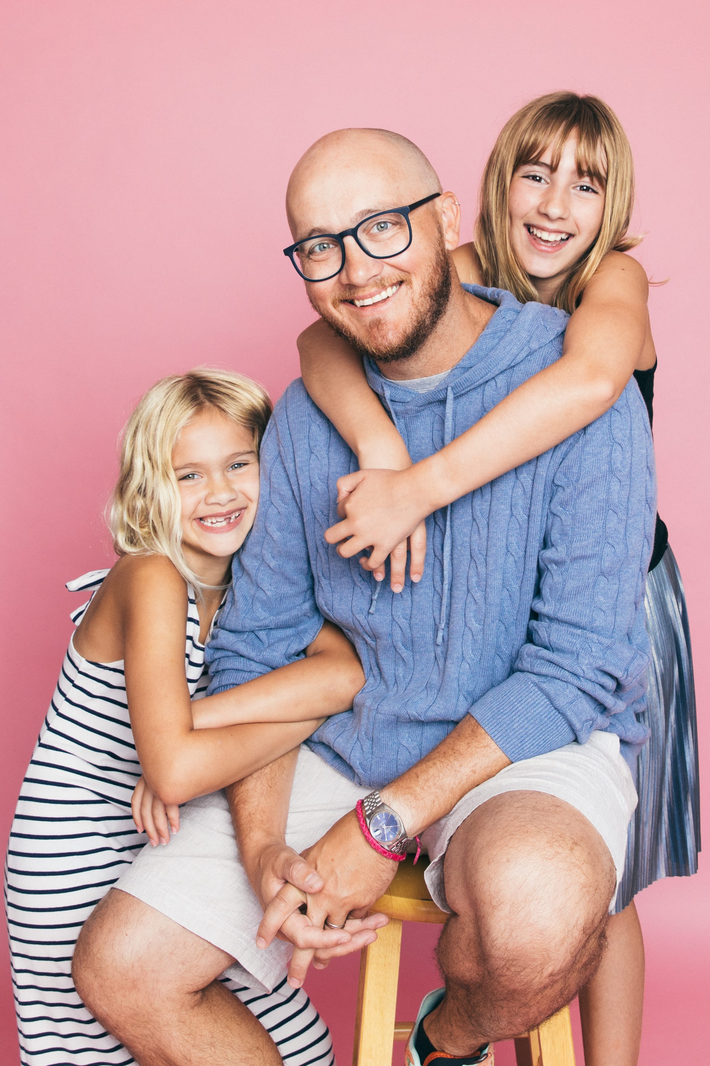 Father and daughters in studio