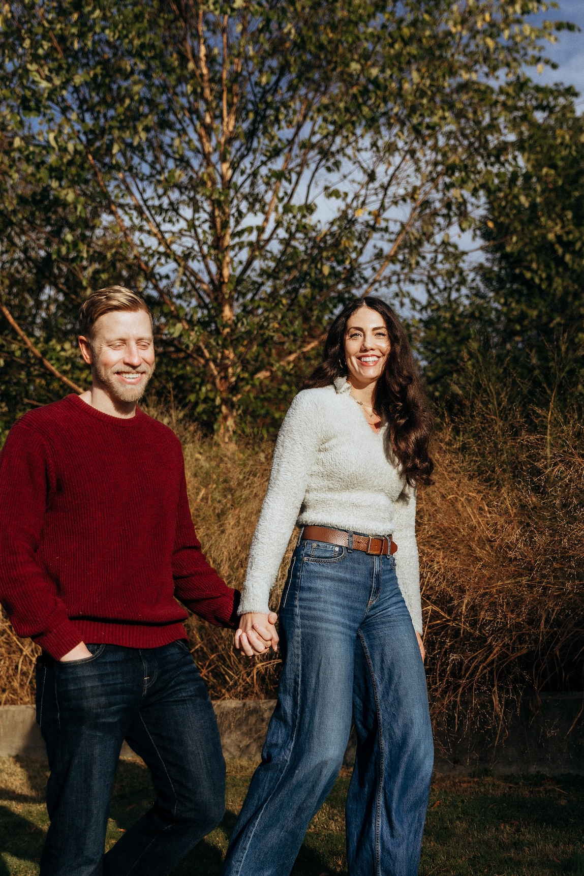 A couple walking together in the fall