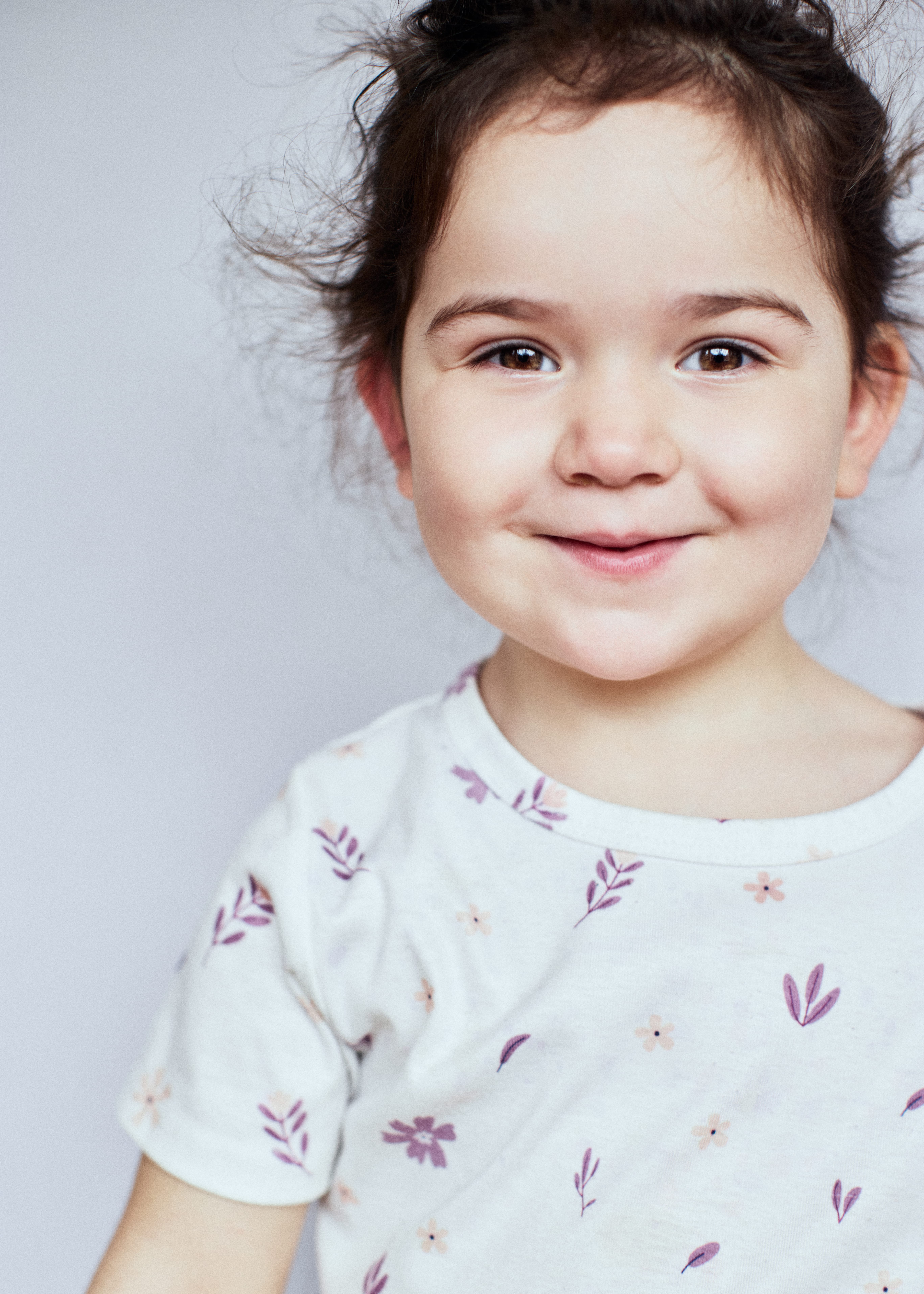 Young child with a gentle smile.