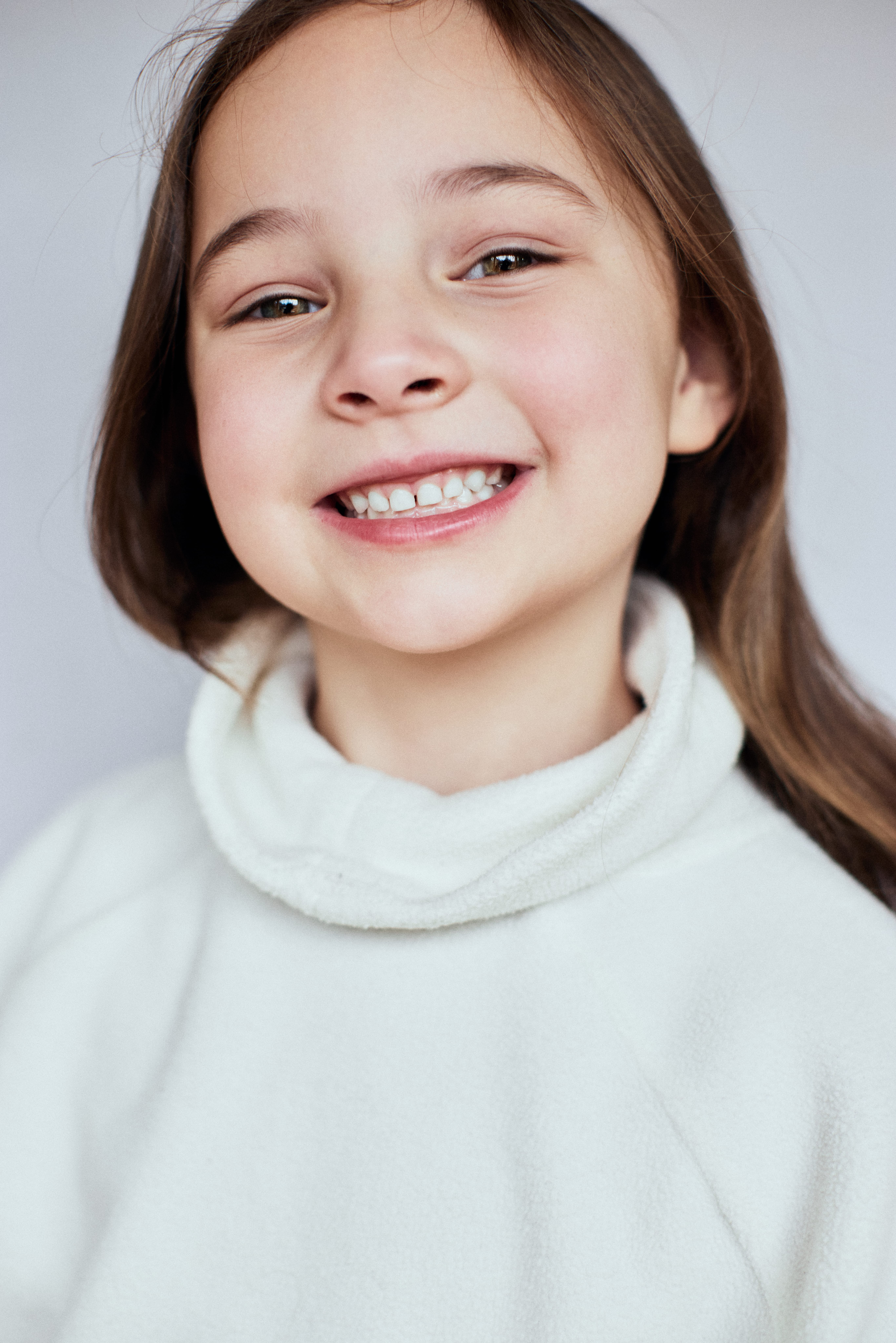 Child photographed during a relaxed portrait session.