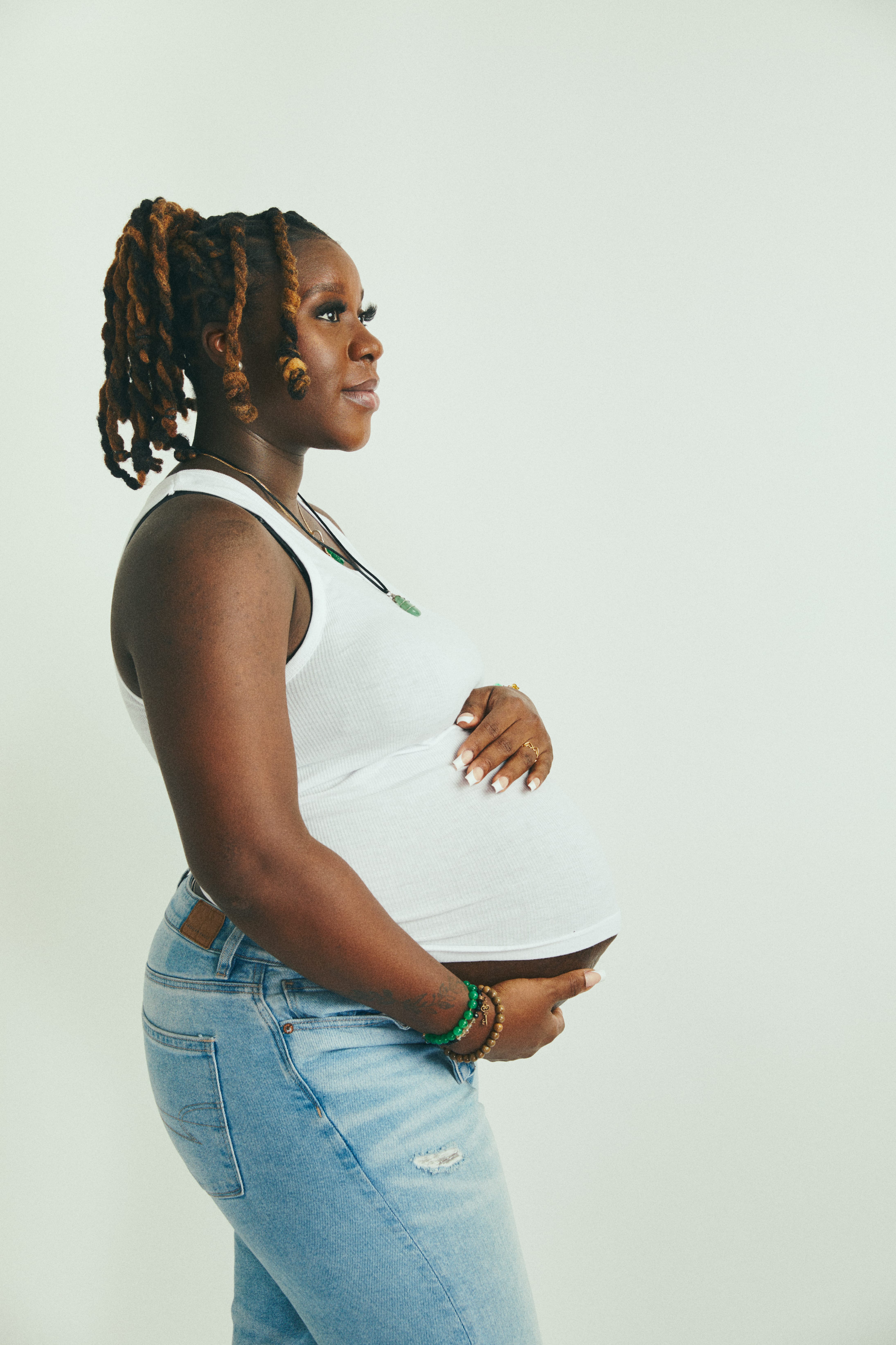Expectant mother holding her belly