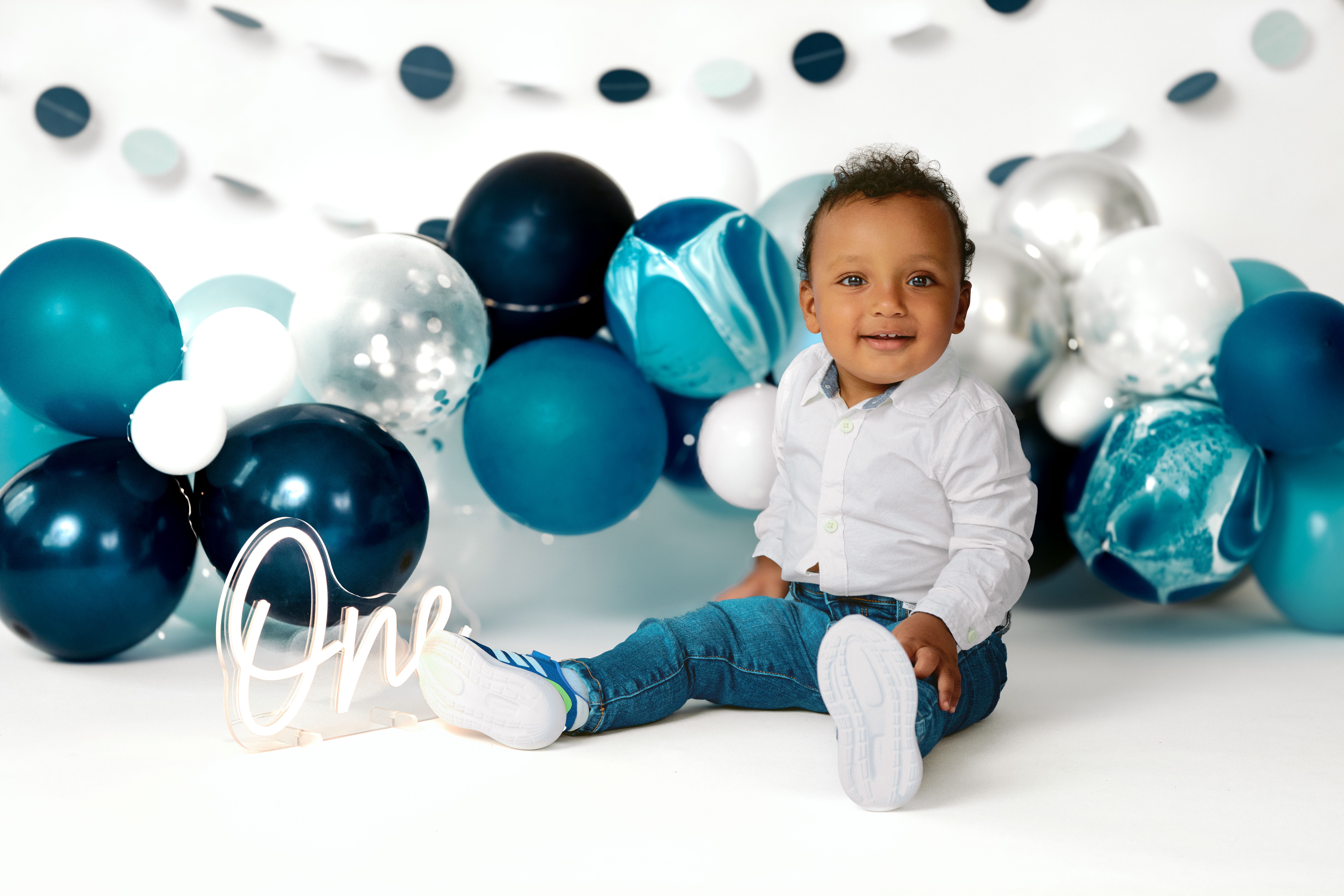 One year old milestone portrait before cake smash