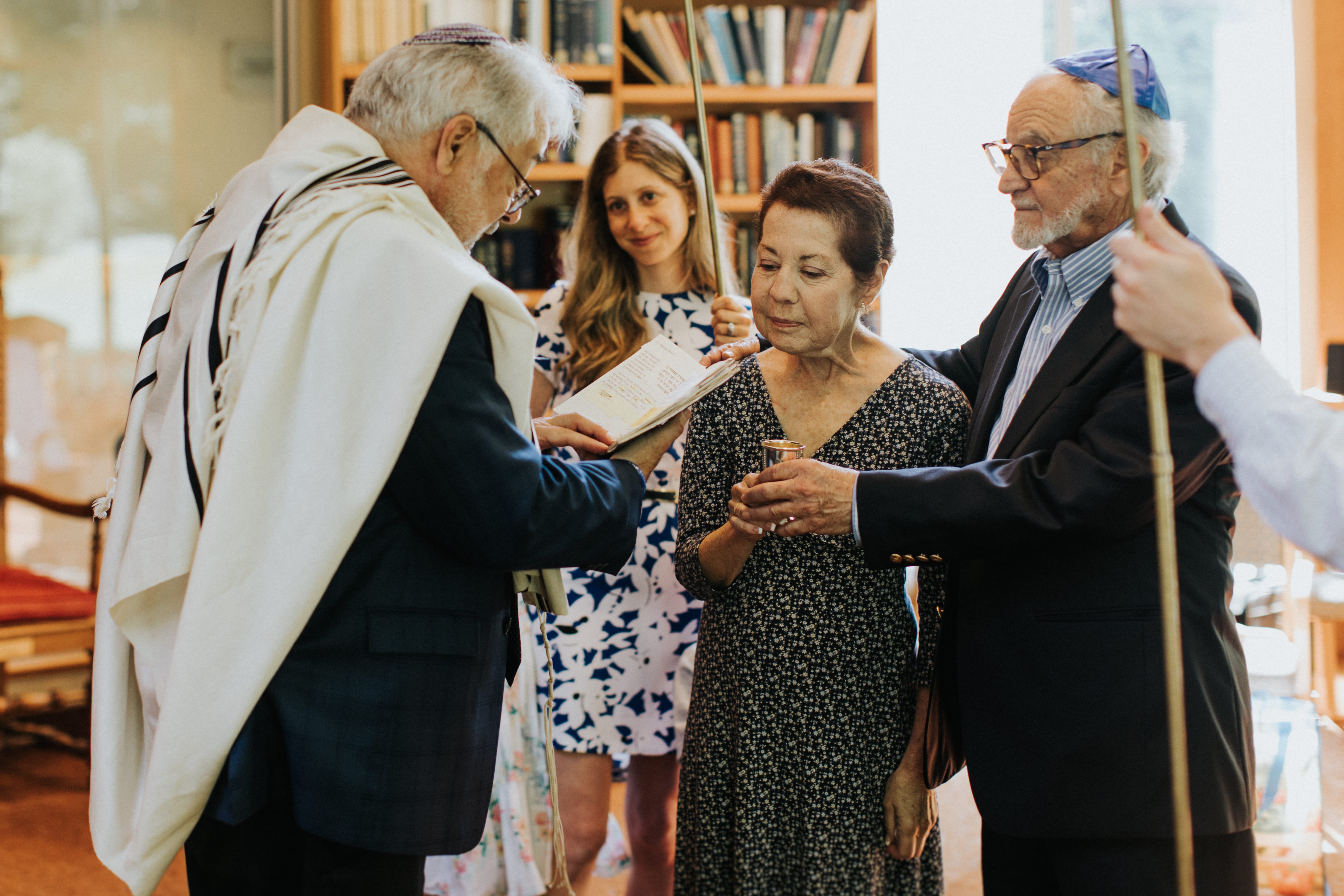 Older couple together during a ceremony at a synagogue