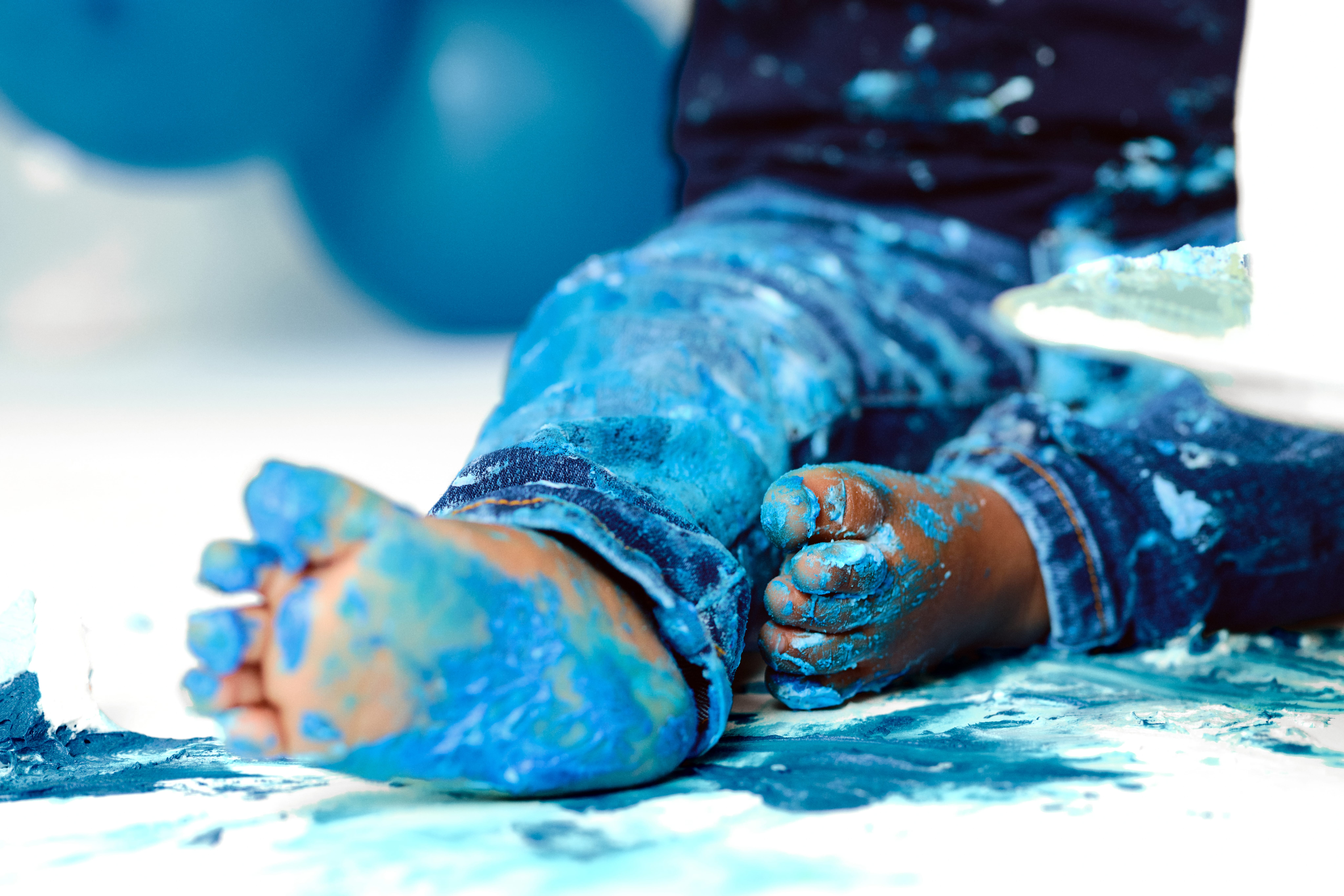 One year old cake smash feet closeup