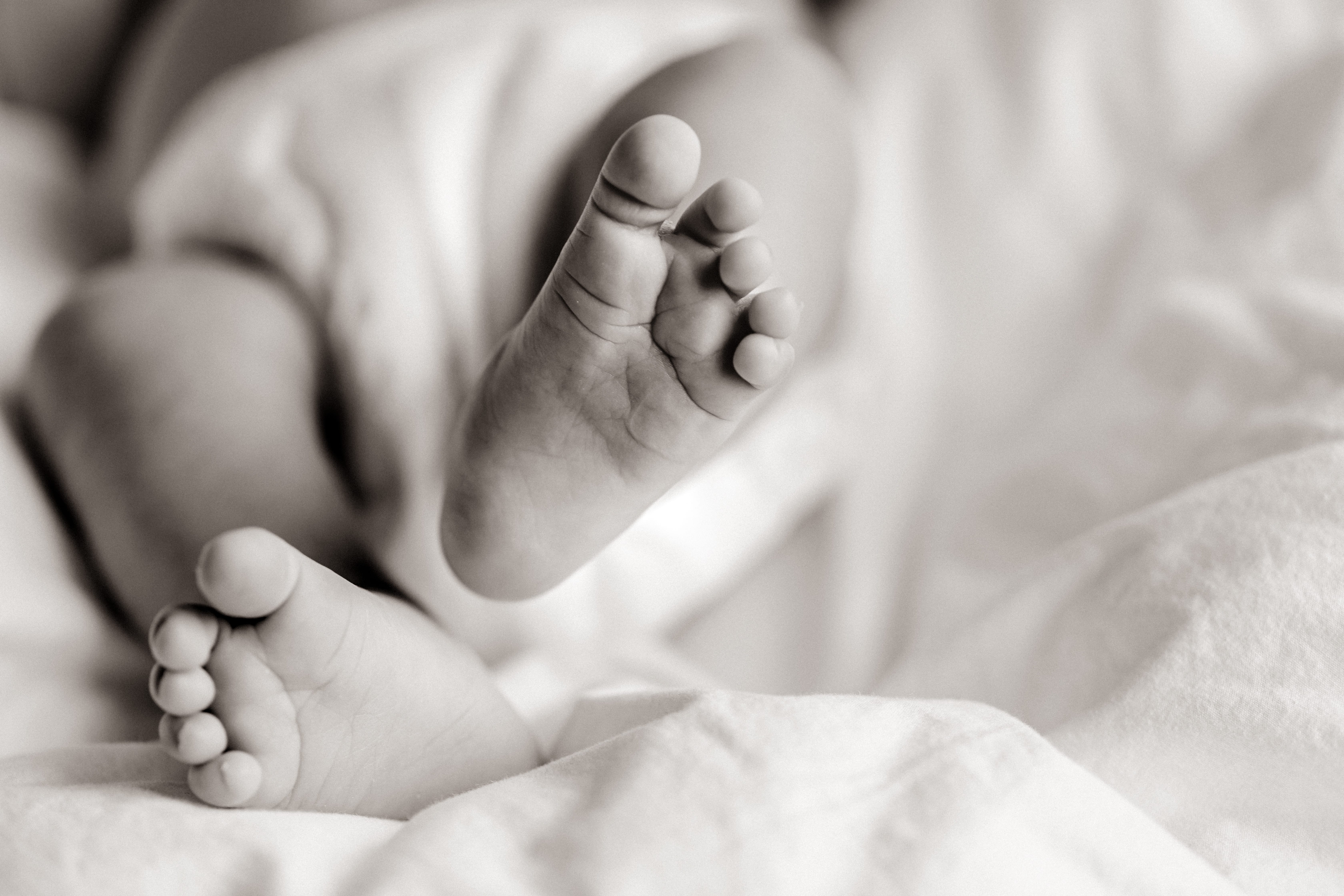Black and white newborn closeup of feet