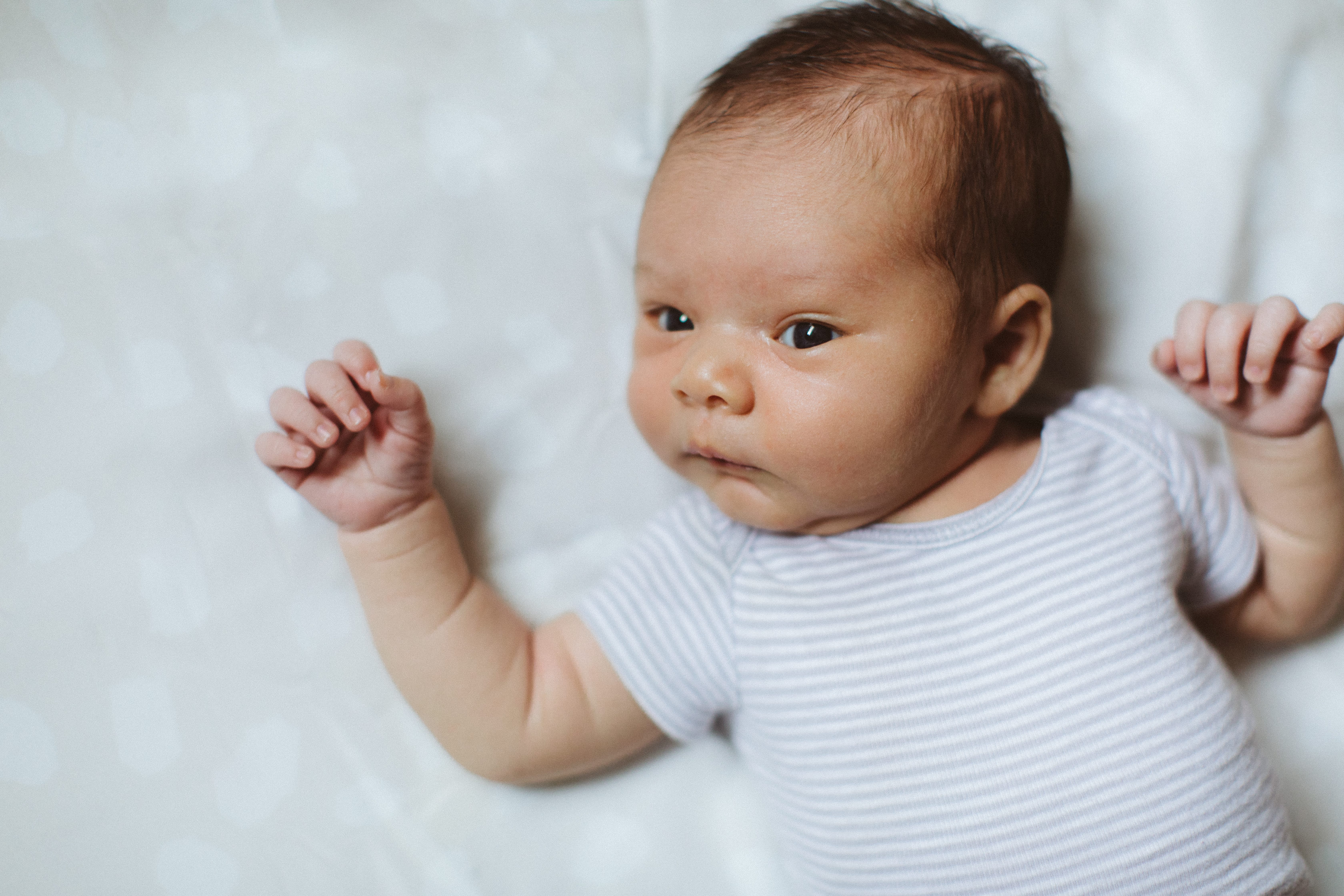 Newborn in bed portrait