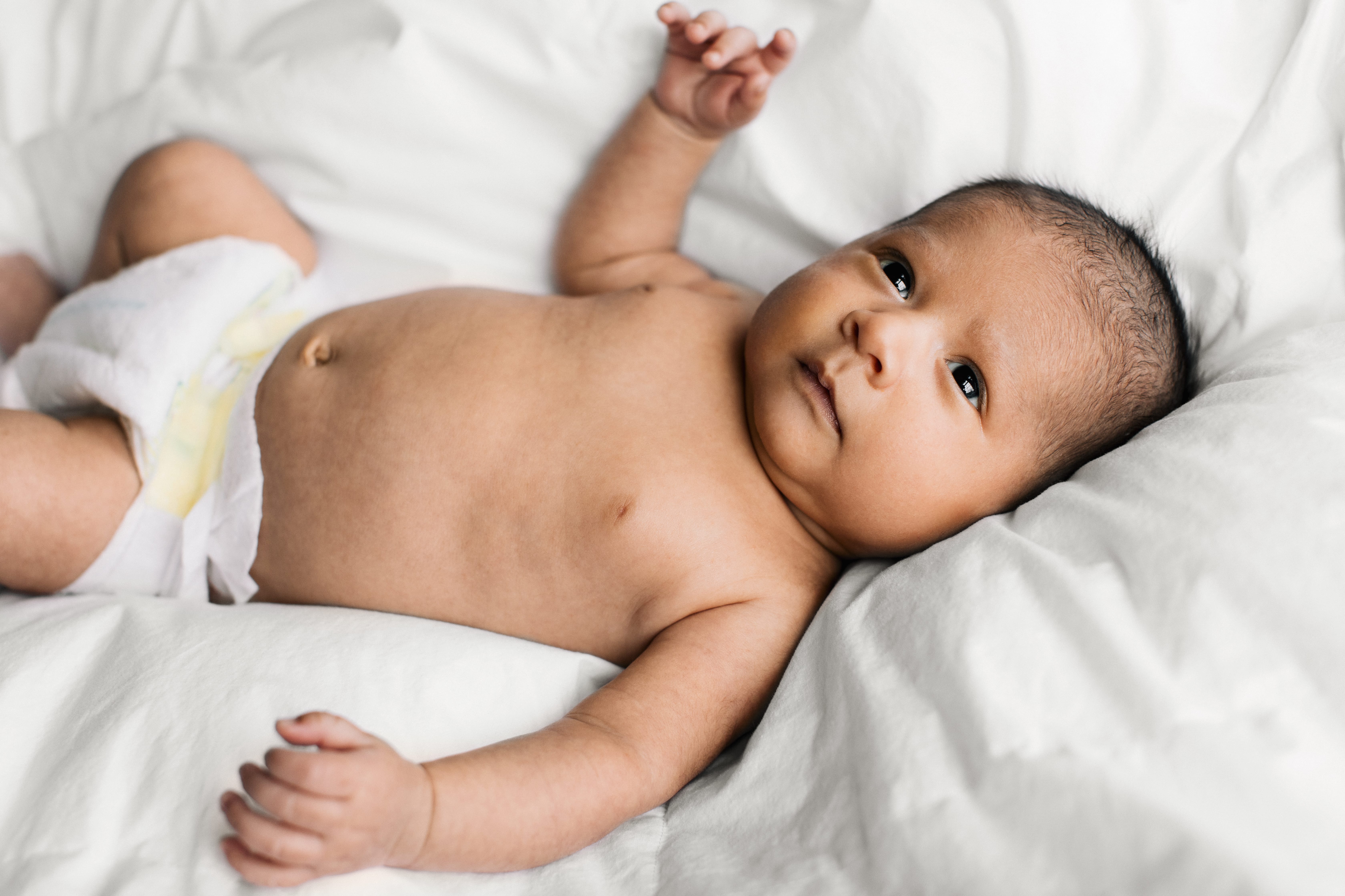Newborn on a bed